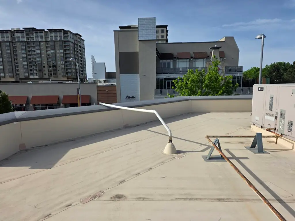 Plumbing vent improperly vented on a roof of a commercial building